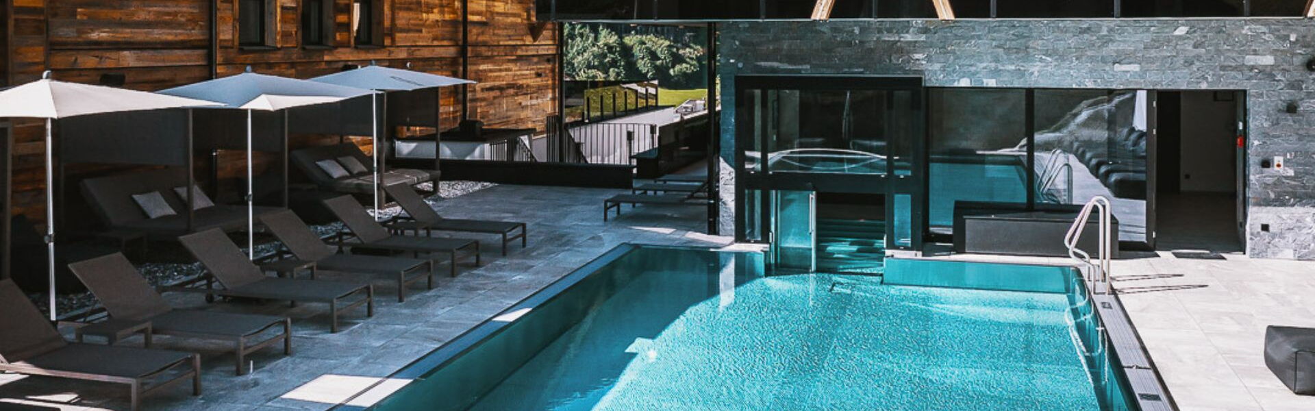 Outdoor pool in the Hotel Glemm by AvenidaA in Hinterglemm